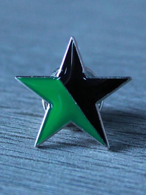Black and green enamel badge